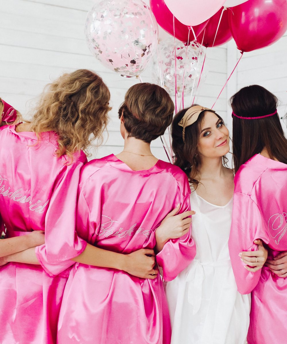 Back,View,Of,Group,Of,Bridesmaids,With,Bride-to-be,In,Beautiful